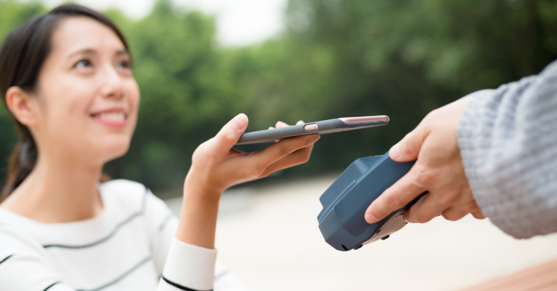 Person paying with phone