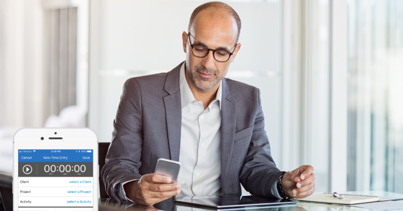 Person using a phone with Bill4Time time tracking app