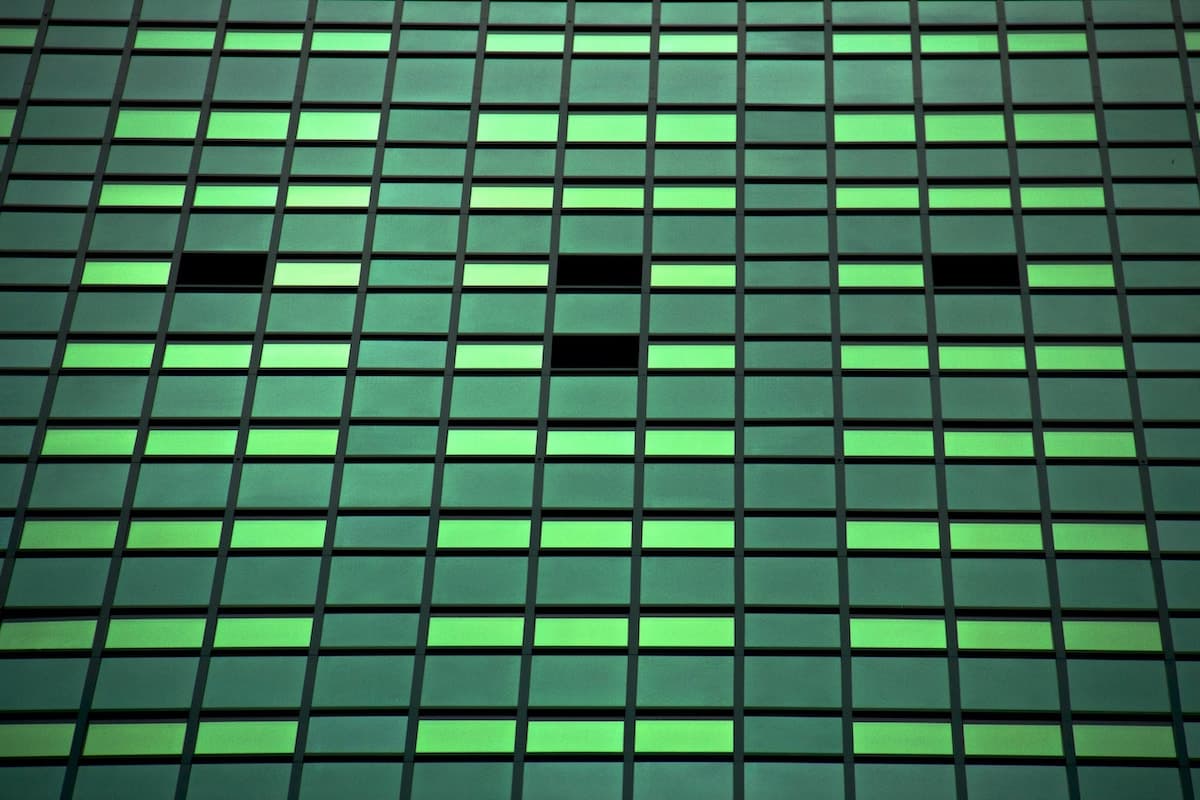 recurring payment plan metaphor with green tinted windows on large building